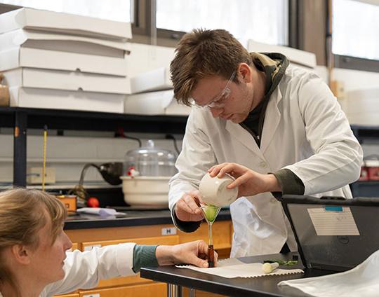 a man and a woman conducting a lab experiment